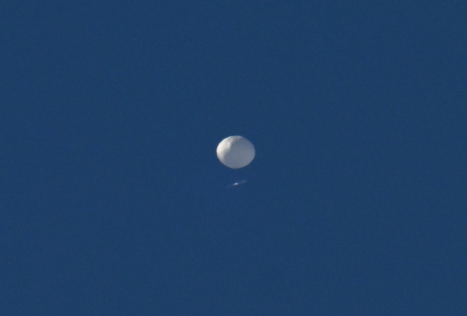 A Chinese spy balloon flies above Charlotte, North Carolina, United States on 4 February. The balloon was later shot down (Peter Zay/Anadolu Agency via Getty Images)